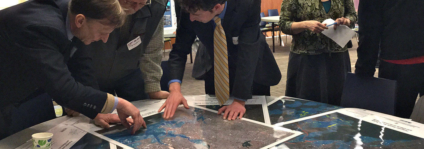 people reviewing maps